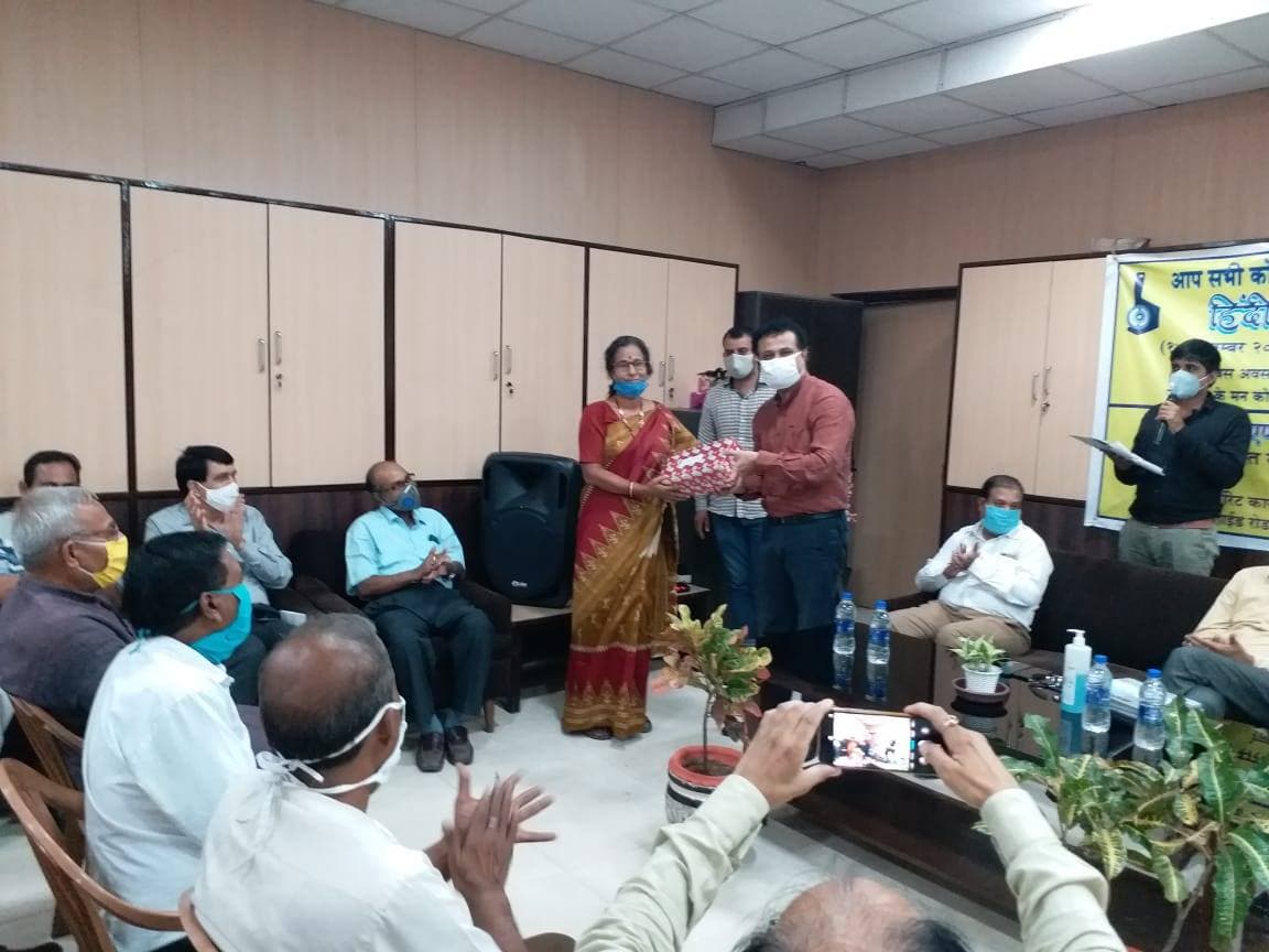 Engineers discussing the design of a new heavy-duty crane model.