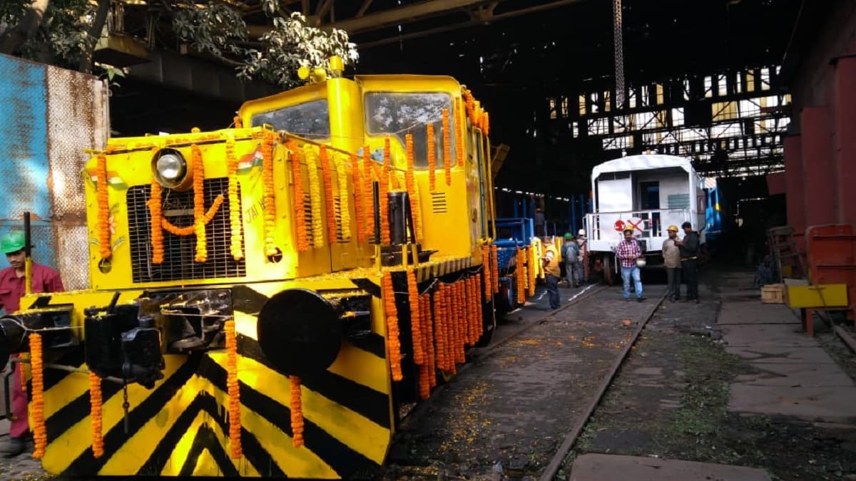 A technician performing final inspections on a completed pressure vessel.