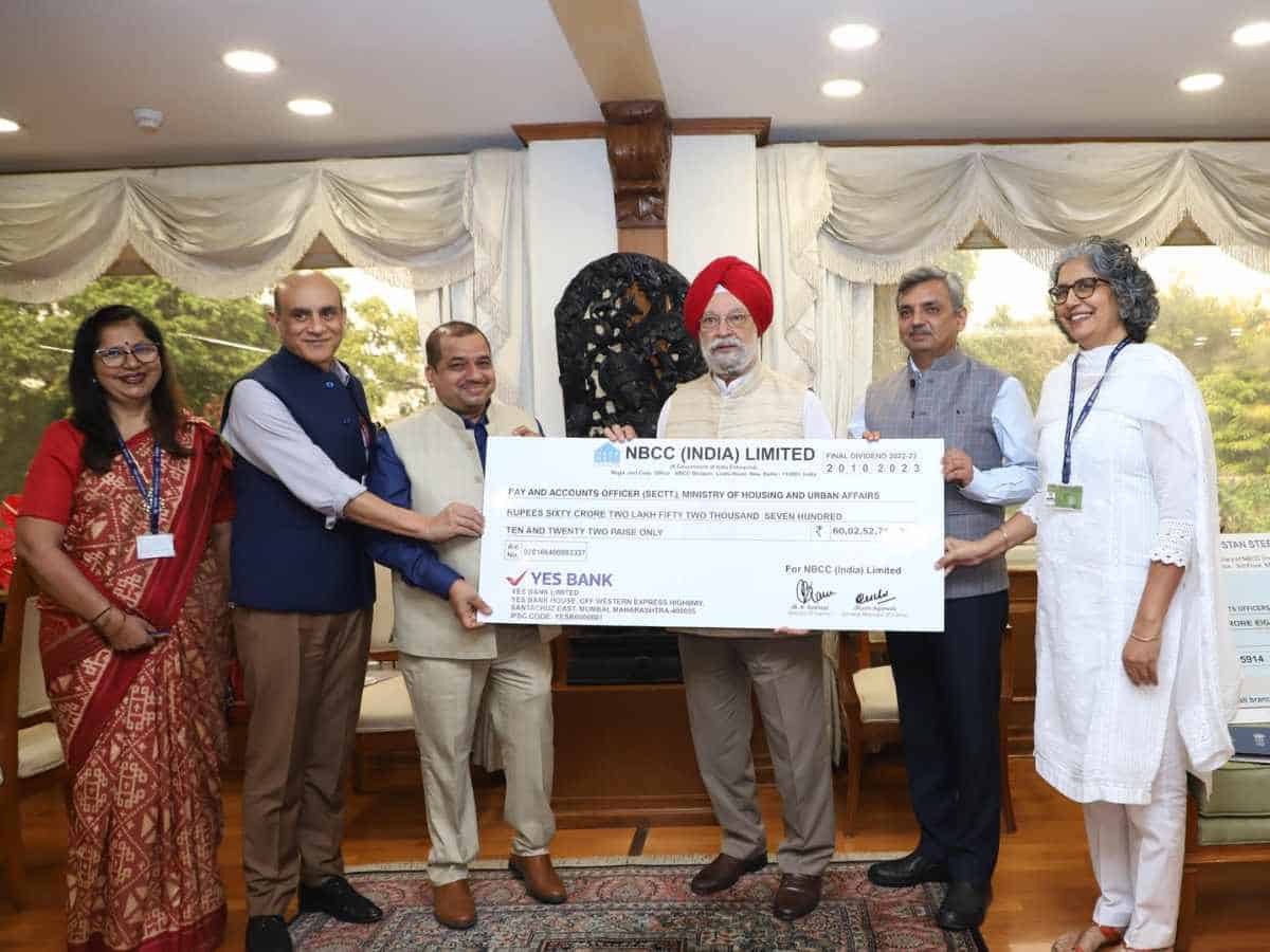 NBCC presents Rs 66 cr dividend cheques to Petroleum Minister