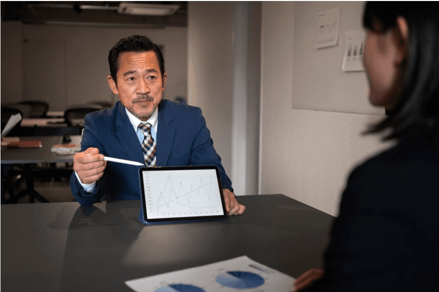 A New India Assurance customer service representative assisting clients, reflecting the company's commitment to customer satisfaction and personalized service