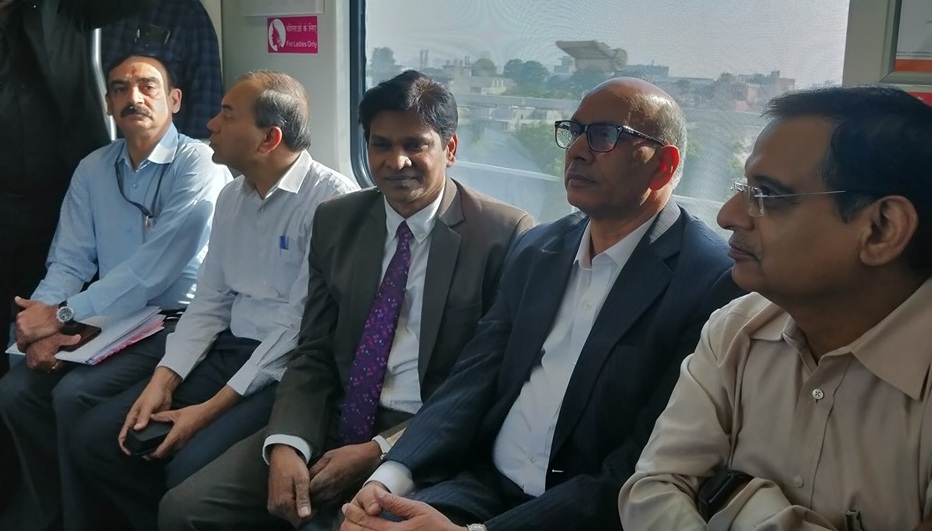 Delhi Metro Rail Corporation MD Dr Mangu Singh travelling on the Rapid Metro