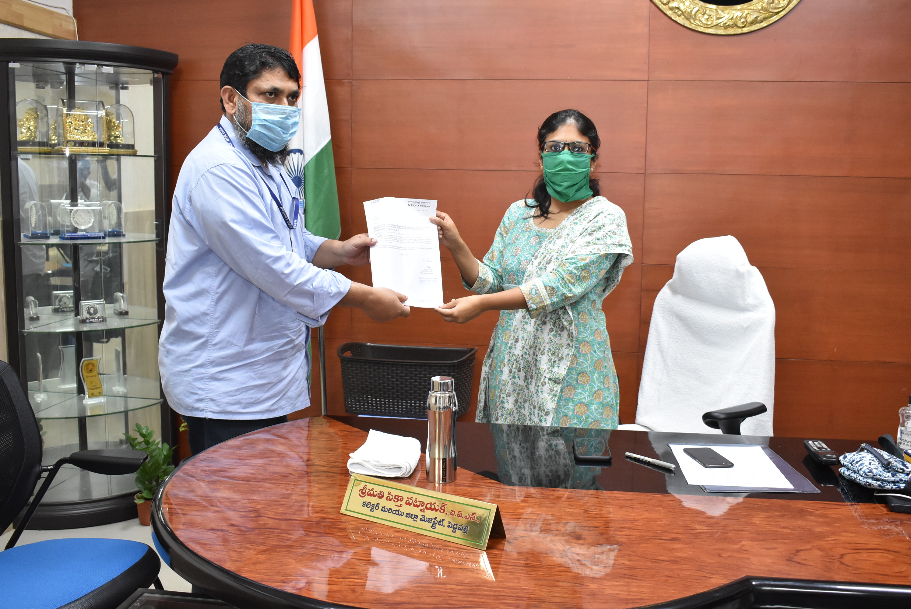 NTPC handed over rs. 99.13 lakh to Peddapalli district administration to fight against COVID-19