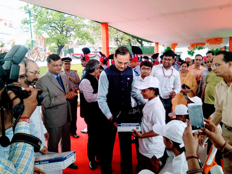 Shri Sanjiv Singh Chairman IndianOil and others are distributing smart canes and braille kits to students